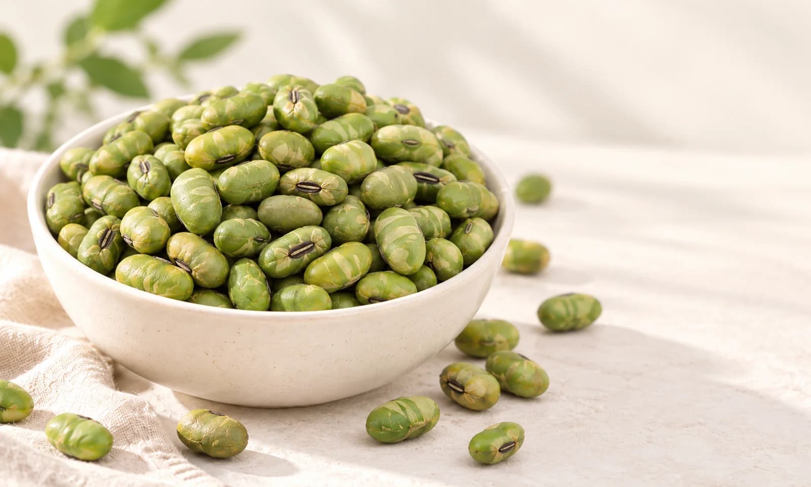 Roasted edamame beans served in a ceramic bowl